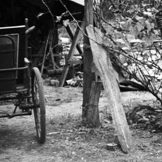 Black and white photo of a woman and child outdoors.