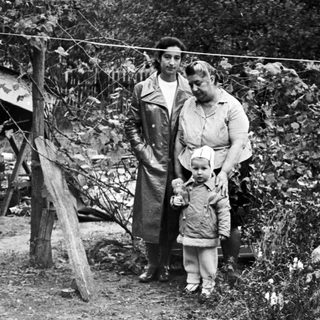Black and white photo of a woman and child outdoors.