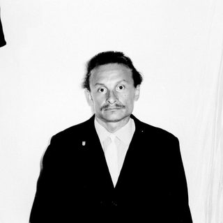 Black and white portrait of a man in a suit.