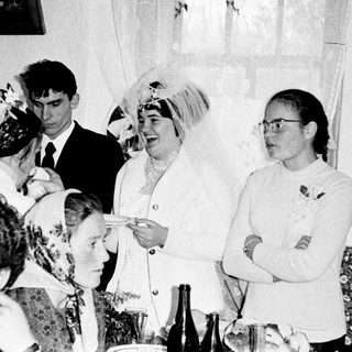 Black and white photo of a wedding celebration gathering.
