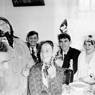 Group gathered at a table, possibly celebrating a wedding.