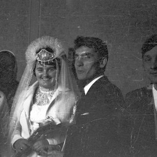 Black and white photo of a couple on their wedding day.