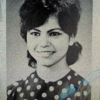 Black and white portrait of a woman with short hair.