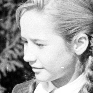 Black and white portrait of a young girl with braids.