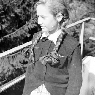 Black and white portrait of a young girl with braids.