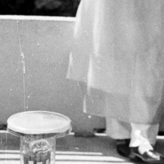 Black and white photo of a table with glassware.