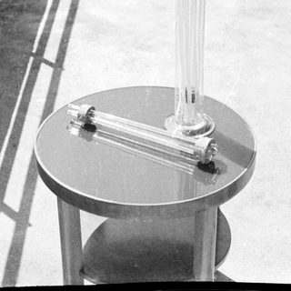 Black and white photo of a table with glassware.