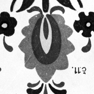 Black and white floral pattern, possibly folk art design.