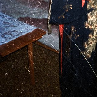 Woman in kimono stands in a room with artwork.
