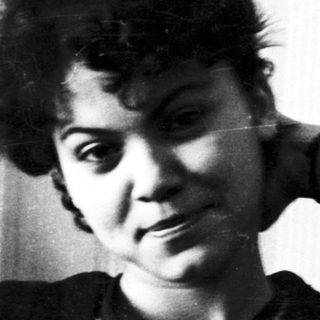 Black and white portrait of a woman with short hair.