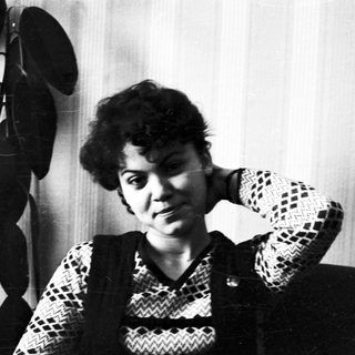 Black and white portrait of a woman with short hair.