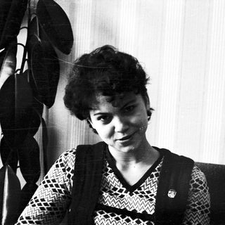 Black and white portrait of a young woman with short hair.