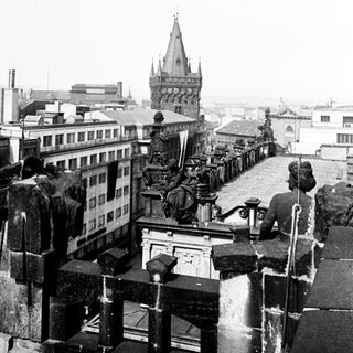 Black and white image of a cathedral and cityscape.