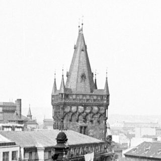 Black and white image of a cathedral and cityscape.