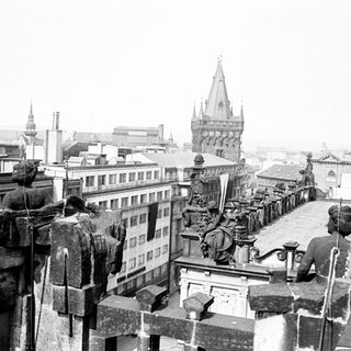 Overhead view of a cityscape with a prominent spire.