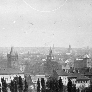 A vintage, hazy view of a European city skyline.
