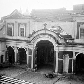 Black and white image of an ornate building courtyard.