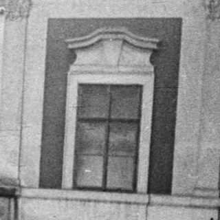 Black and white image of an ornate building courtyard.