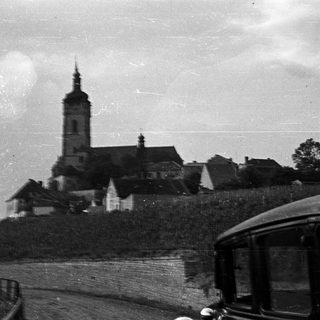 Black and white image of a church and village scene.