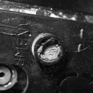 Close-up of aged metal with rust and texture.