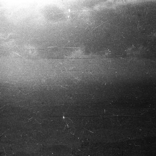 Ominous dark sky with visible cloud cover and damage.