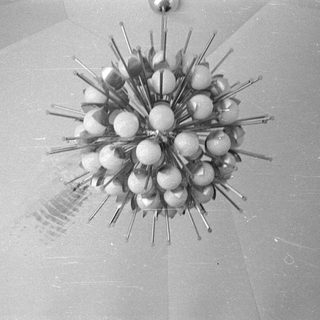 Black and white image of a Sputnik-style chandelier.