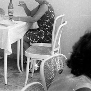 People dining at a table in a vintage restaurant.
