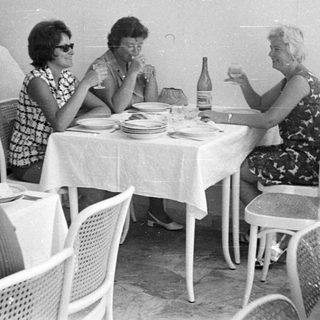 People dining at a table in a vintage restaurant.