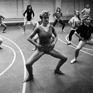 Black and white photo of women in a dance class.