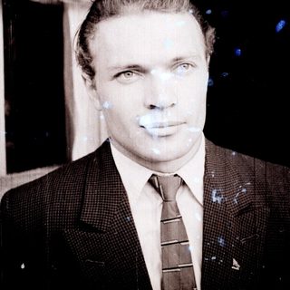 Black and white portrait of a man in a suit.