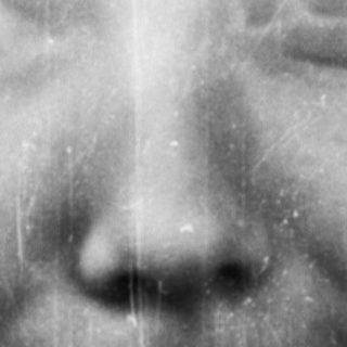Black and white portrait of a woman with visible film grain.