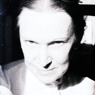 Man with a pipe, appearing blurred and dynamic.
