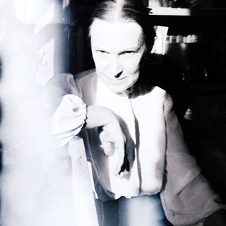 Man with a pipe, appearing blurred and dynamic.