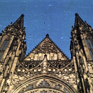 Close-up of a Gothic cathedral's ornate facade and towers.