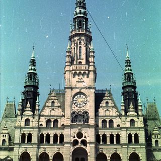 A grand, ornate building with towers and a clock.