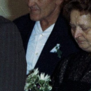 Wedding portrait of a couple and their attendants.