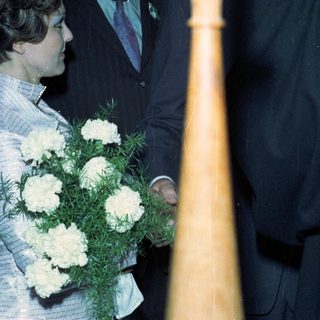 People attending a ceremony, possibly a graduation or wedding.