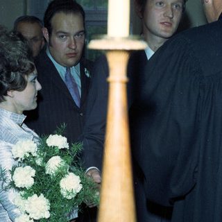 People attending a ceremony, possibly a graduation or wedding.