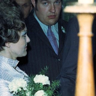 People attending a ceremony, possibly a graduation or wedding.
