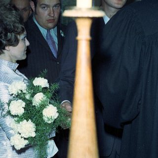 People attending a ceremony, possibly a graduation or wedding.