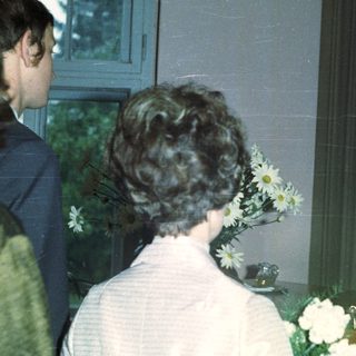 Couple being married by a priest in a church.