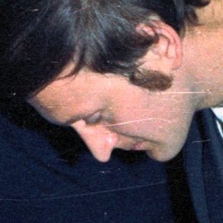 Prince Charles signing a document, likely a marriage certificate.