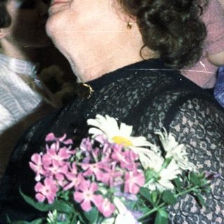 Couple embracing, likely at a wedding or celebratory event.