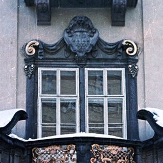 Elaborate, snow-covered doorway of a historic building.