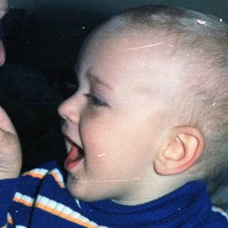 Woman and baby appear to be interacting closely.