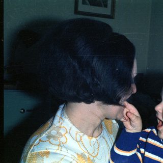 Woman and baby appear to be interacting closely.