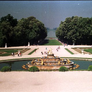 Formal gardens with a fountain and manicured landscaping.