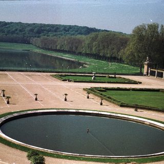 Formal gardens with a pond and manicured landscaping.