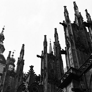 Black and white image of a gothic cathedral exterior.