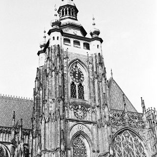 Black and white image of a gothic church tower.